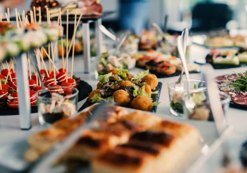 Table full of tasty food beautifully decorated.